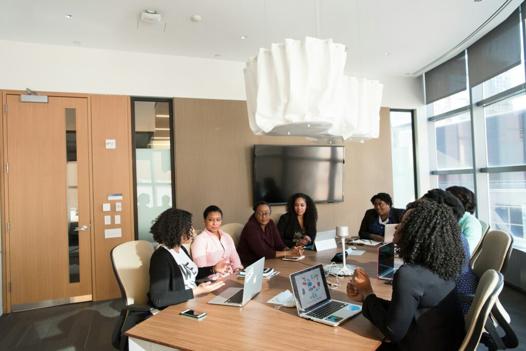Women sitting at a conference table in an office building