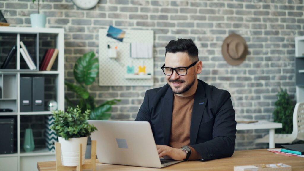 Man using digital identity solution on a laptop in an office