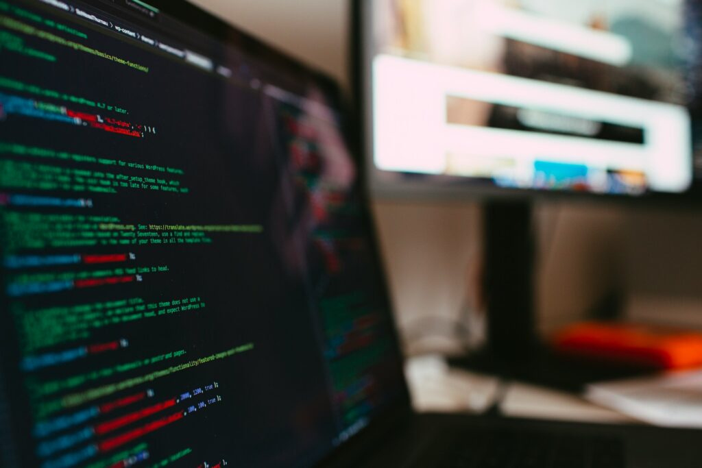 Lines of cybersecurity code on a dark laptop screen.
