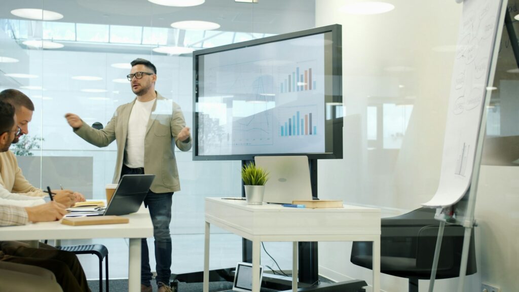 business leader discussing operationalization of technology to colleagues in a breakout room